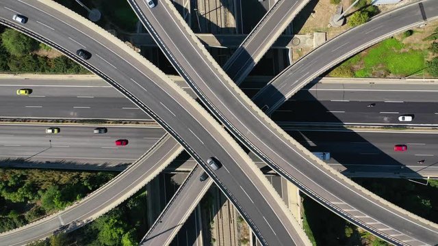 Aerial drone hyper lapse video of urban multilevel junction with light traffic