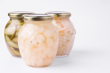 Fermented vegetables on a white background.