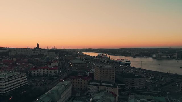Aerial over the Gota alv river in Gothenburg at dusk. Drone slow forward dolly