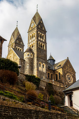 Fototapeta na wymiar Parish Church of the Saints Cosmas and Damian at Clervaux, Luxembourg, low-angle view