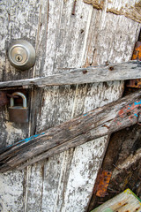 The old wooden door was damaged and very old lock key no longer available
