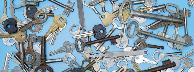 Keys set on blue background. Door lock keys and safes for property security and house protection....