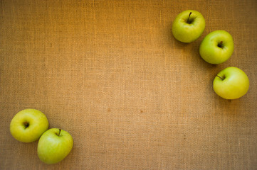 Apples on burlap and a place for inscription.