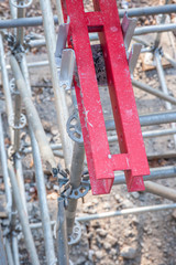 Fototapeta na wymiar Wooden and metal beams lean on scaffolding.