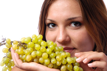 Hungry girl wants to eat delicious juicy grapes