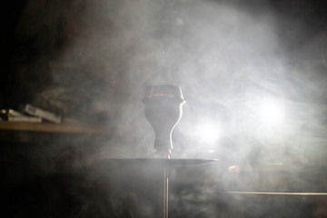 the hookah place with lots of smoke in the dark room