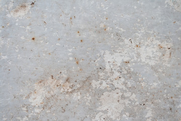 Gray rusty metal surface with peeling paint