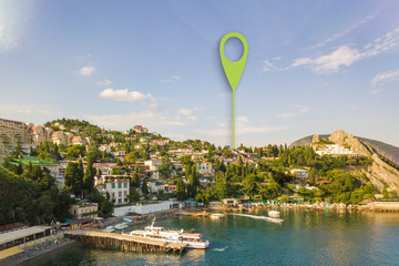 aerial panorama on the nature landscape and small village in the mountains with a geotag pin location