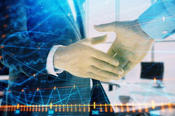 Multi exposure of financial graph on office background with two businessmen handshake. Concept of success in business