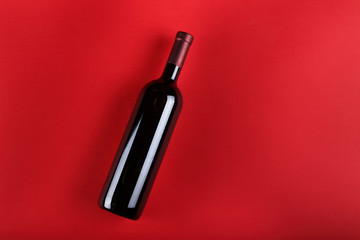 bottle of wine on a red background
