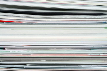 Background from stacked magazines, brochures, notebooks, catalogs