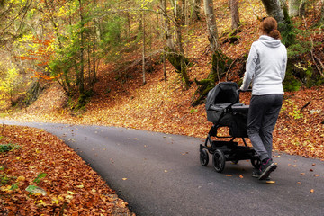 Woman with pram outside in forest © Jaroslav Moravcik