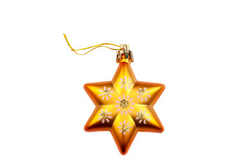 Orange star Christmas tree decoration with painted flowers and gold powder isolated on white background