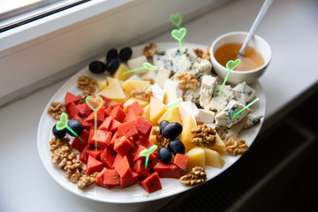 Cheese plate served with honey
