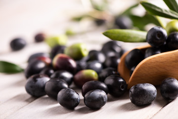 Green and black olives  on table.
