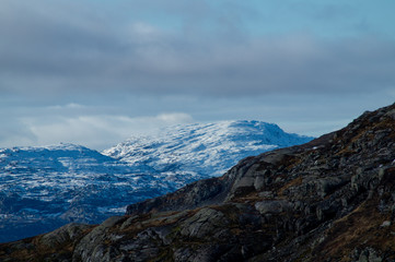 Mountains tops with snow and clouds