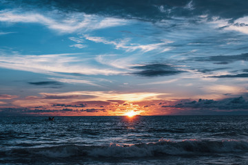 Fototapeta na wymiar Amazing colorful sunset with deep blue sky on the beach in Sri Lanka island