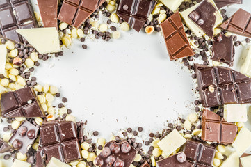 Broken pieces of dark, milk and white chocolate