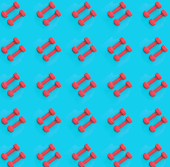 Pink dumbbell pattern on a blue background