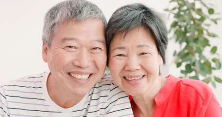elder couple smile to you