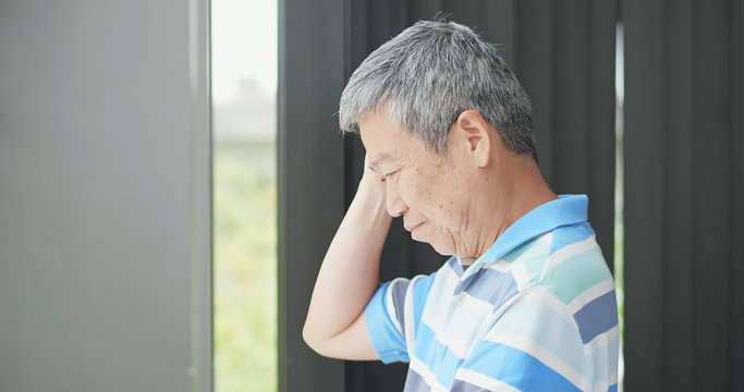 elder man look through window