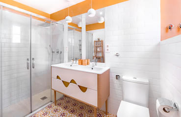 Young and trendy interior design. Modern and colorful bathroom with wooden cabinet.  Yellow and...