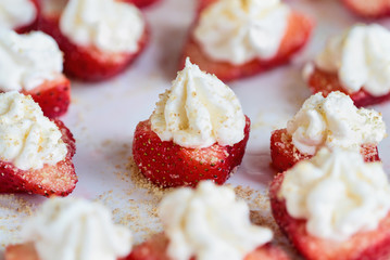 Stuffed strawberries filled with cheesecake filling made with whipped cream and cream cheese....
