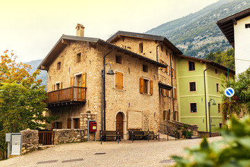 Fototapeta na wymiar Old small stone street in Italy. City of Ranzo province of Trento.