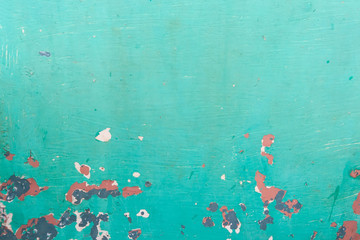 Old green background with peeling paint