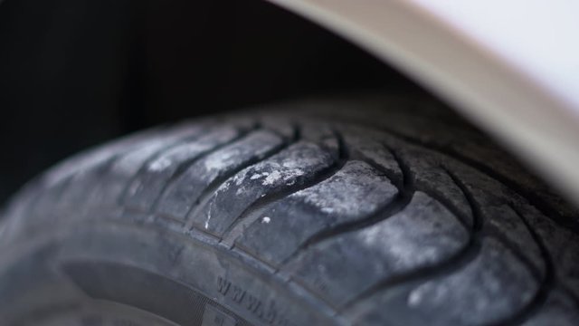 Tyre sand stones white dirt detail on car