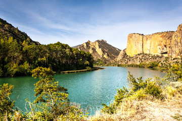 Nice and peaceful view of the lake with a rocky mountains blackground. Sant LLorenç swamp. Catalonia.  Segre river.