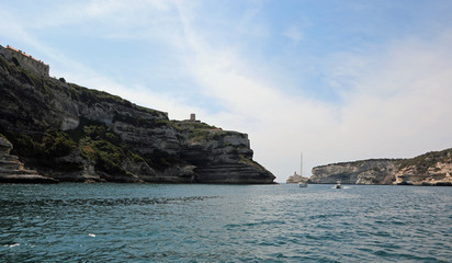 Fototapeta na wymiar Cliff and sea near Bonifacio Town and the Yacht