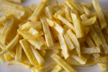 chips (french fries) in white dish