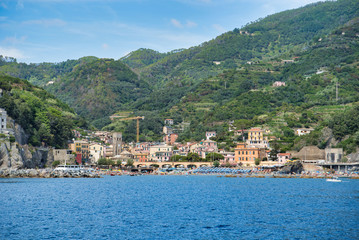 Sea bay with beach, mountain and village view in Cinque Terre, Italy