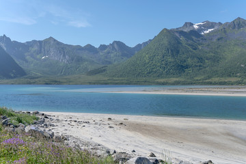 beaches of white sand  in fjord near Stronstad, Norway