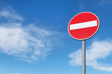 No entry round traffic sign in front of blue sky