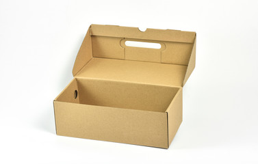 Empty cardboard shoe box isolated on white background