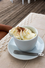 Coffee with cream and cocoa powder