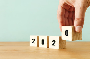 New year 2020 concept. business idea over wooden board