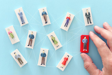 business concept image of people figures over wooden table, human resources and management concept