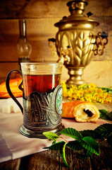 A glass of tea with thyme
