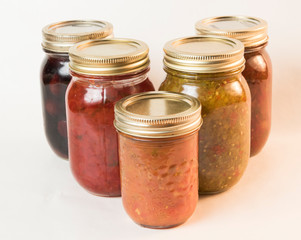 five jars of homemade preserves