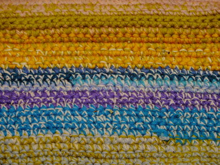 the texture of the knitted fabric is a thick multi-colored thread