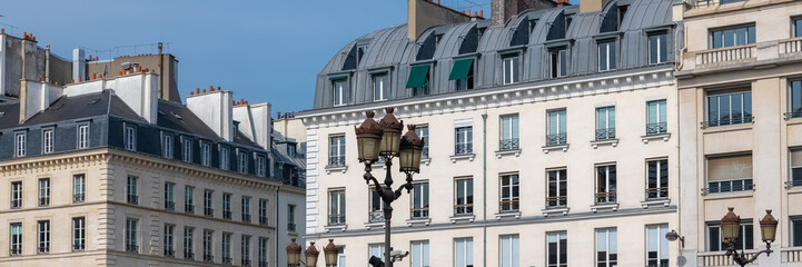 Paris, France, beautiful buildings, panorama of typical parisian facades with ancient lampposts