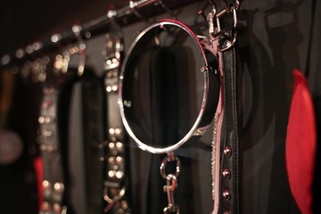 Whips for BDSM on a dark background. Accessory for sexual games.
