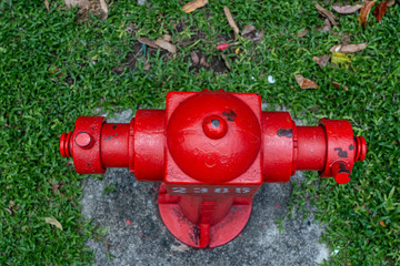 Red fire hydrant in a city street for firefighters, Singapore