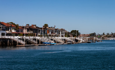 Fototapeta na wymiar waterfront homes on Newport Beach harbor in California