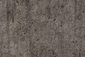 the old stone wall is gray, with cracks