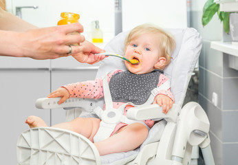 Cute little baby girl in a kitchen