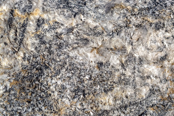 the structure of the stone, such as basalt or granite 